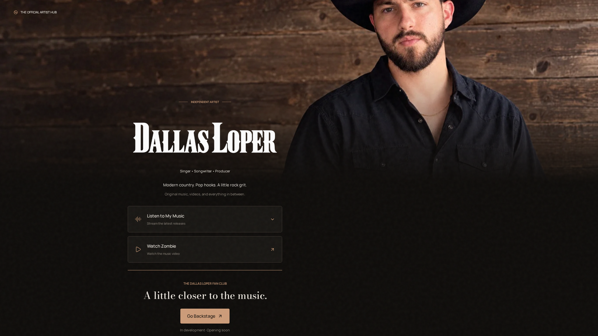 Latest supplied unpublished Dallas Loper homepage snapshot: original portrait and white wordmark, music and video destinations, and Go Backstage marked in development and opening soon.